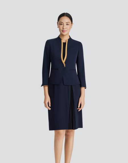 Bộ đồng phục nữ- áo vest viền vàng- chân váy xanh đen